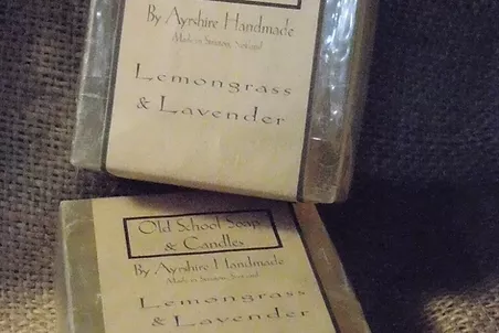 two soap bars with labels on them