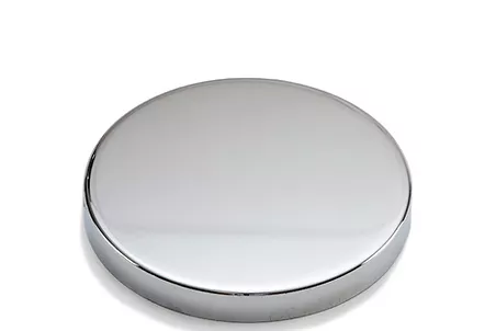 a round metal object on a white background
