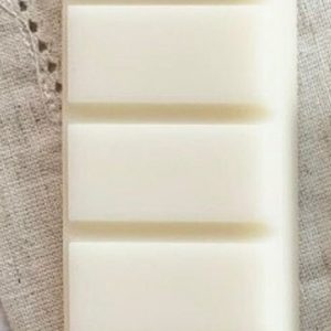 a close up of two white soap bars